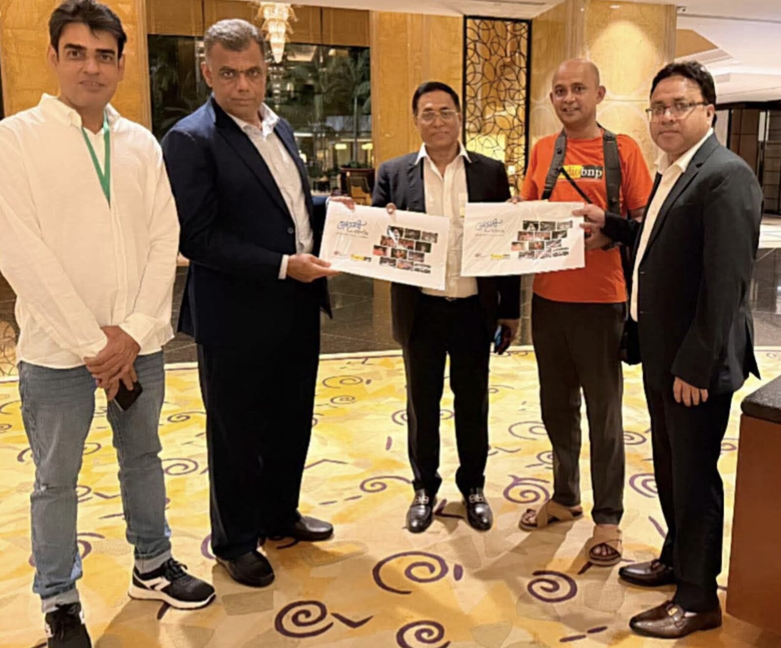 Group photo with colleagues in a hotel lobby, Malaysia